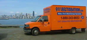 Water Damage Restoration Truck Driving To Job Site