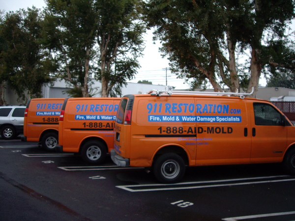 911 Restoration vans parked